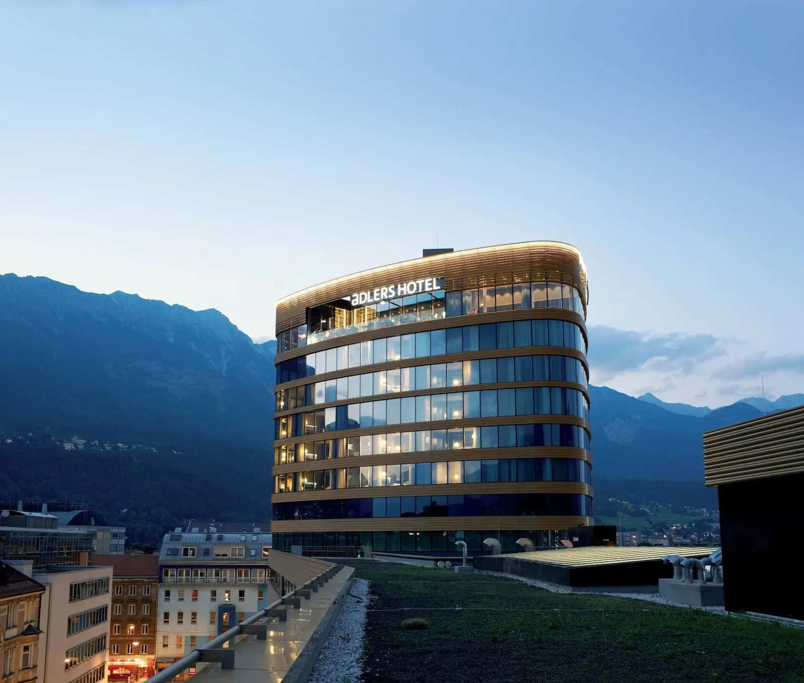 ADLERS Hotel Innsbruck: The ADLERS tower above Innsbruck with the mountains behind