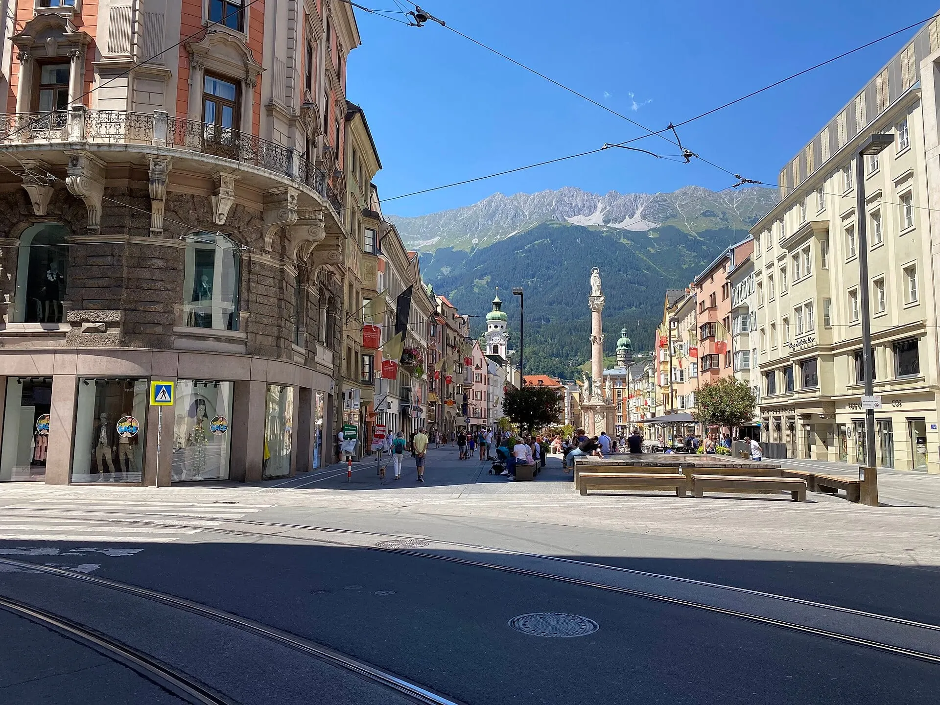 Maria-Theresien-Strasse and St Anne's Column with the mountains behind