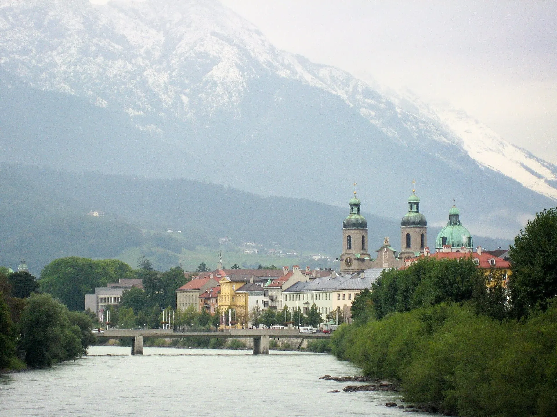 The Inn river and the cathedral towers below the snow-covered Nordkette