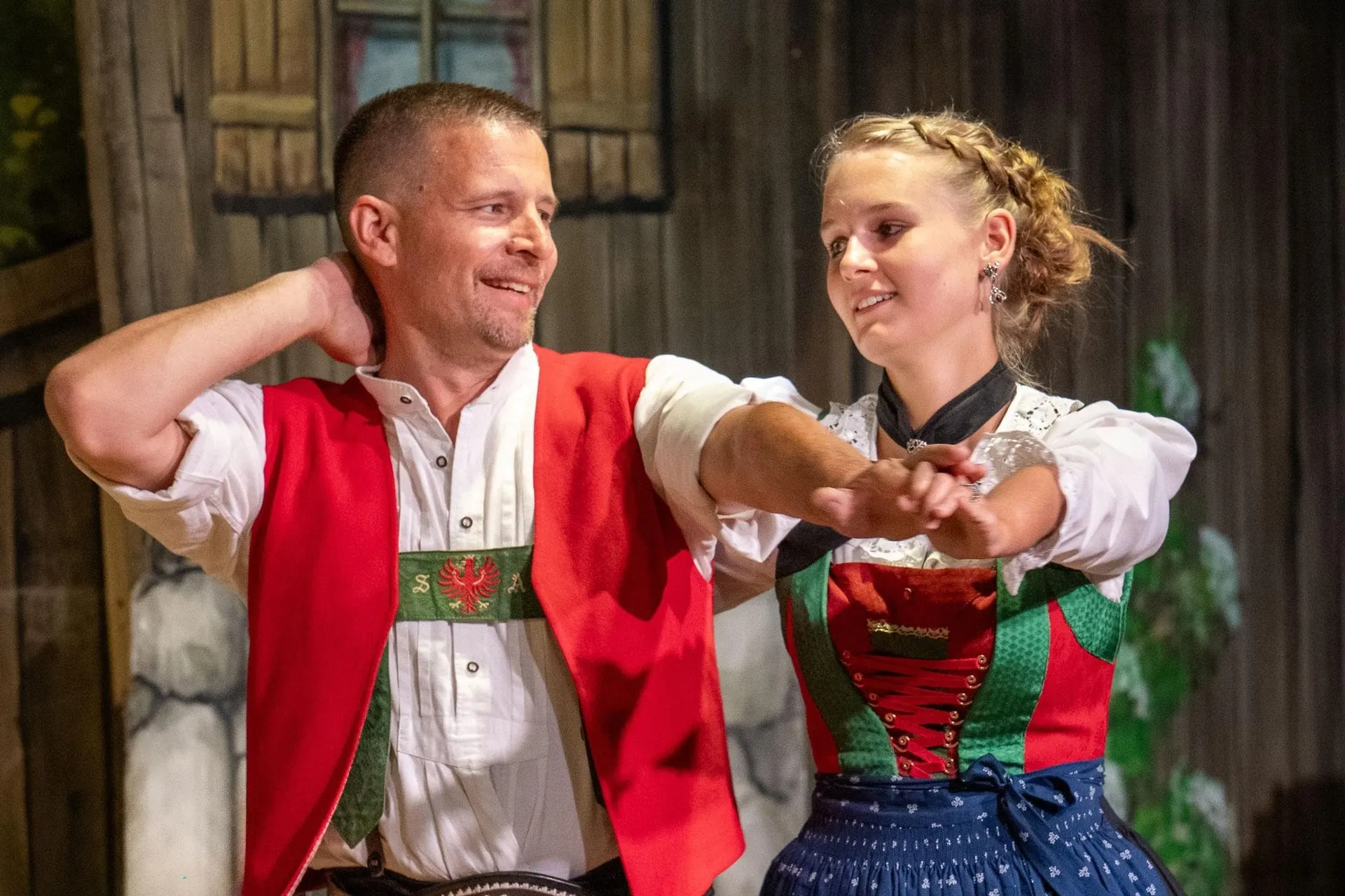Couple in traditional dress dancing at the Tyrolean evening