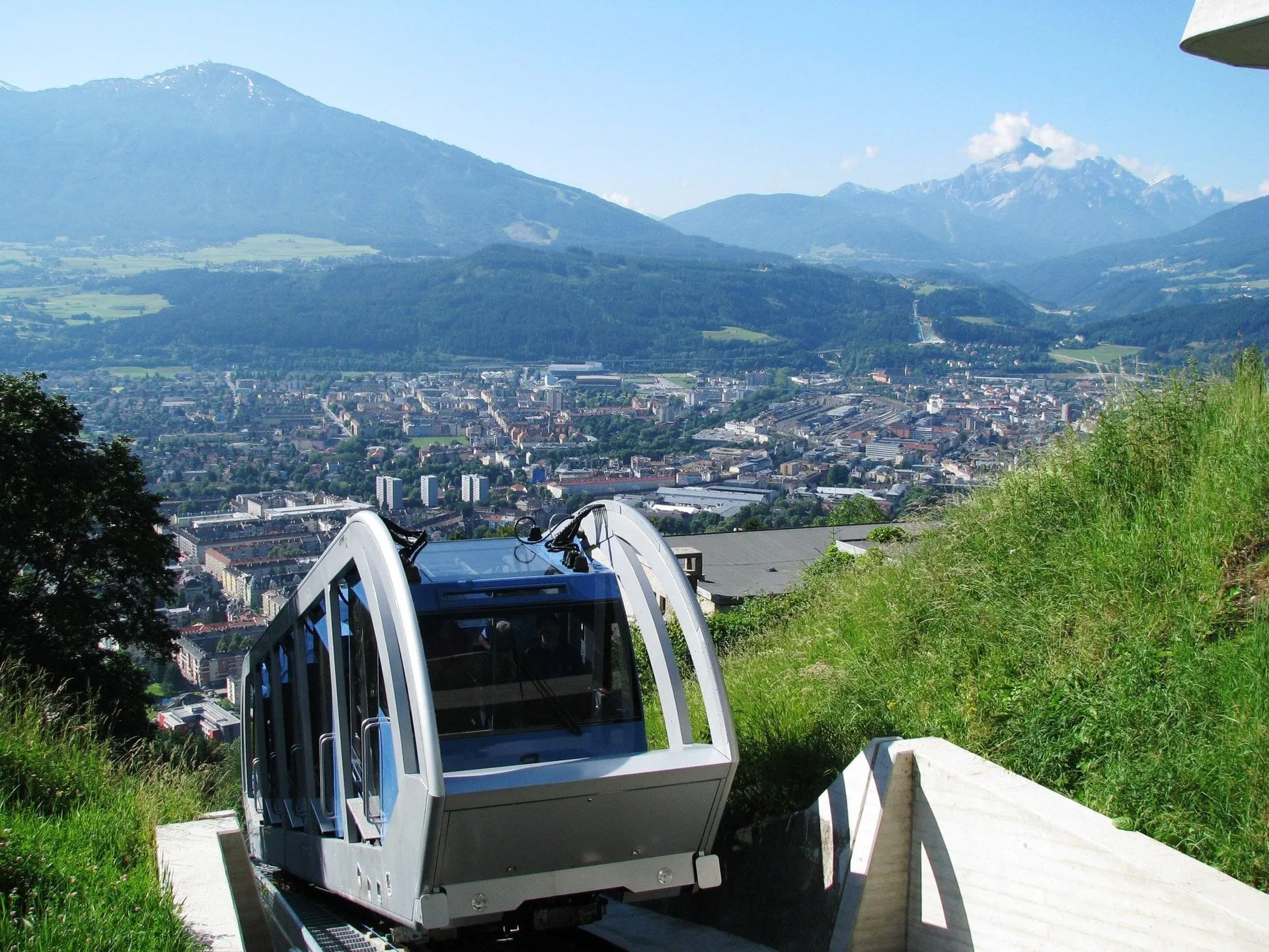 Hungerburg funicular car above Innsbruck with mountains across the valley
