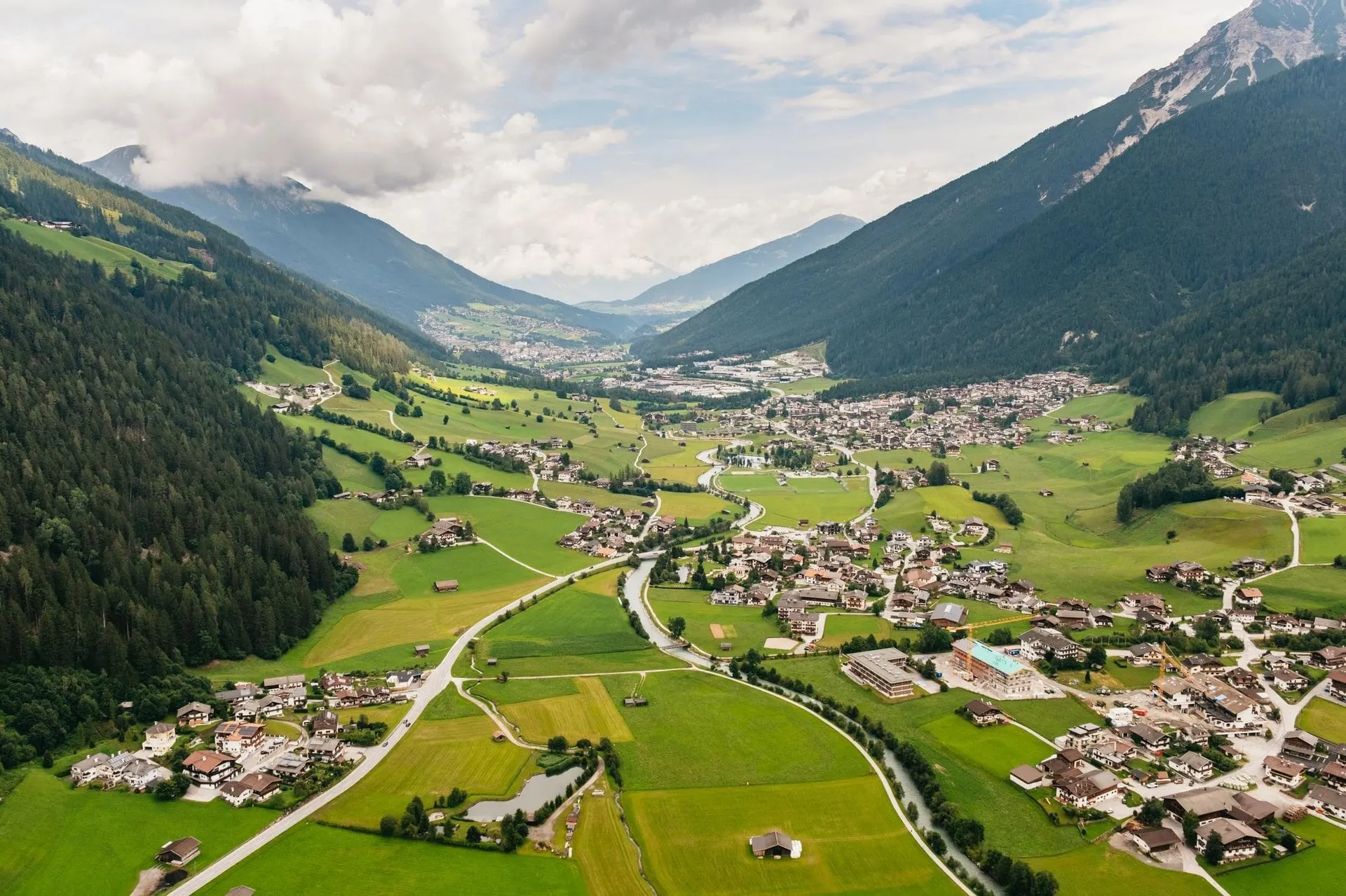 Neustift and the green Stubai Valley floor seen from the air
