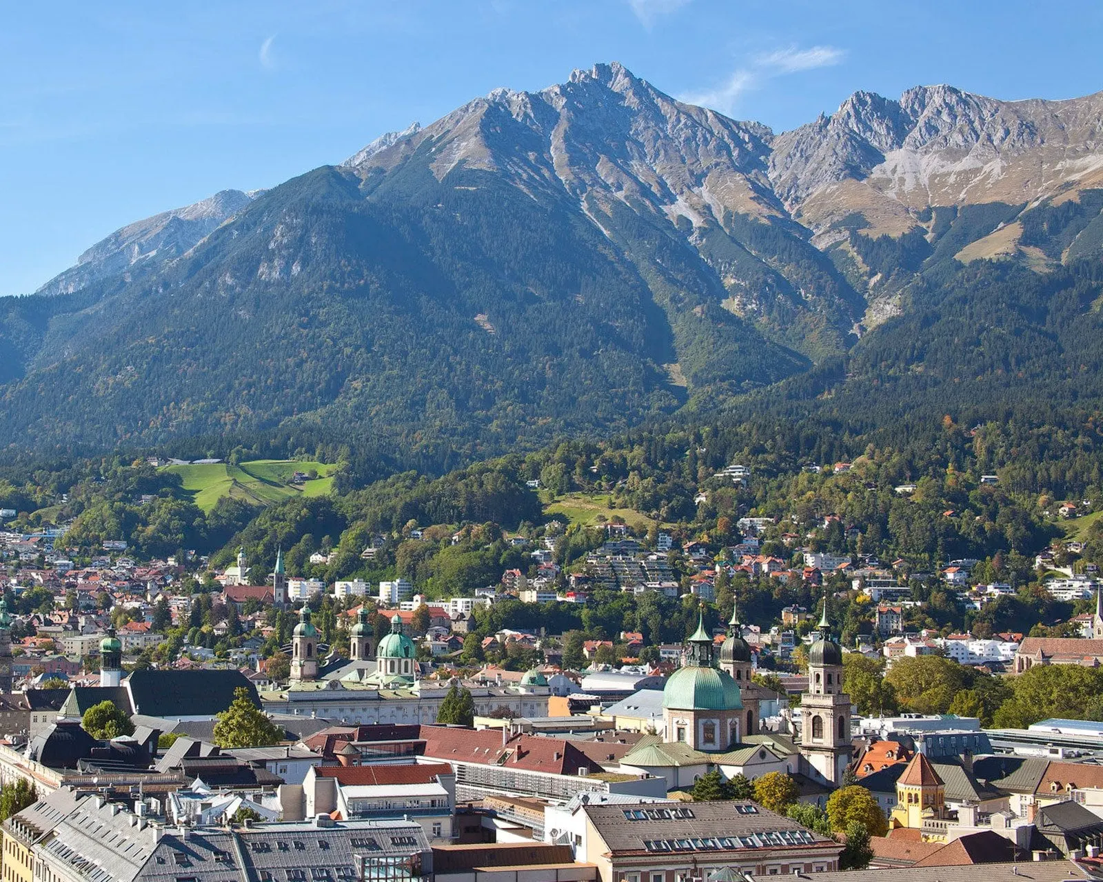Innsbruck rooftops and church domes below the Nordkette