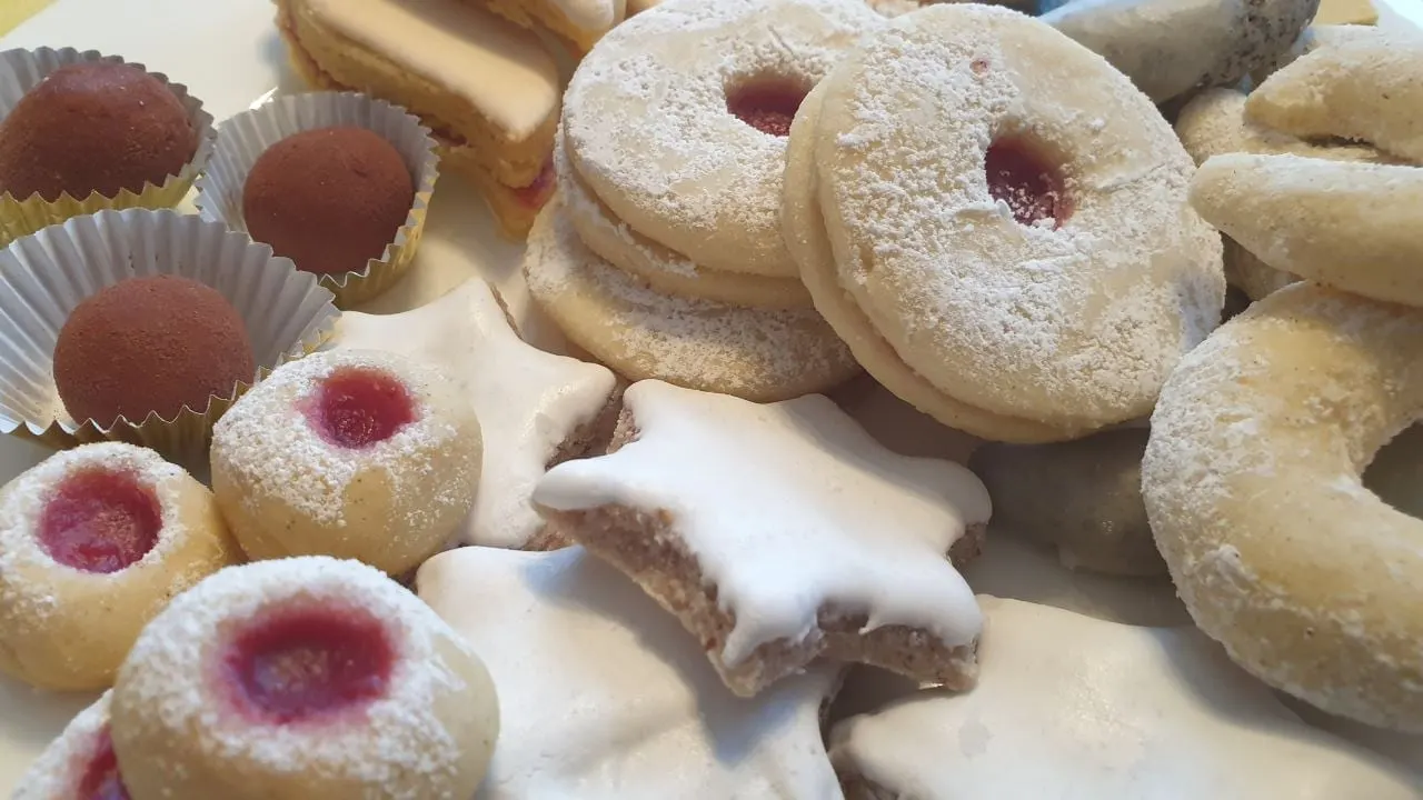 Plate of Christmas biscuits dusted with sugar