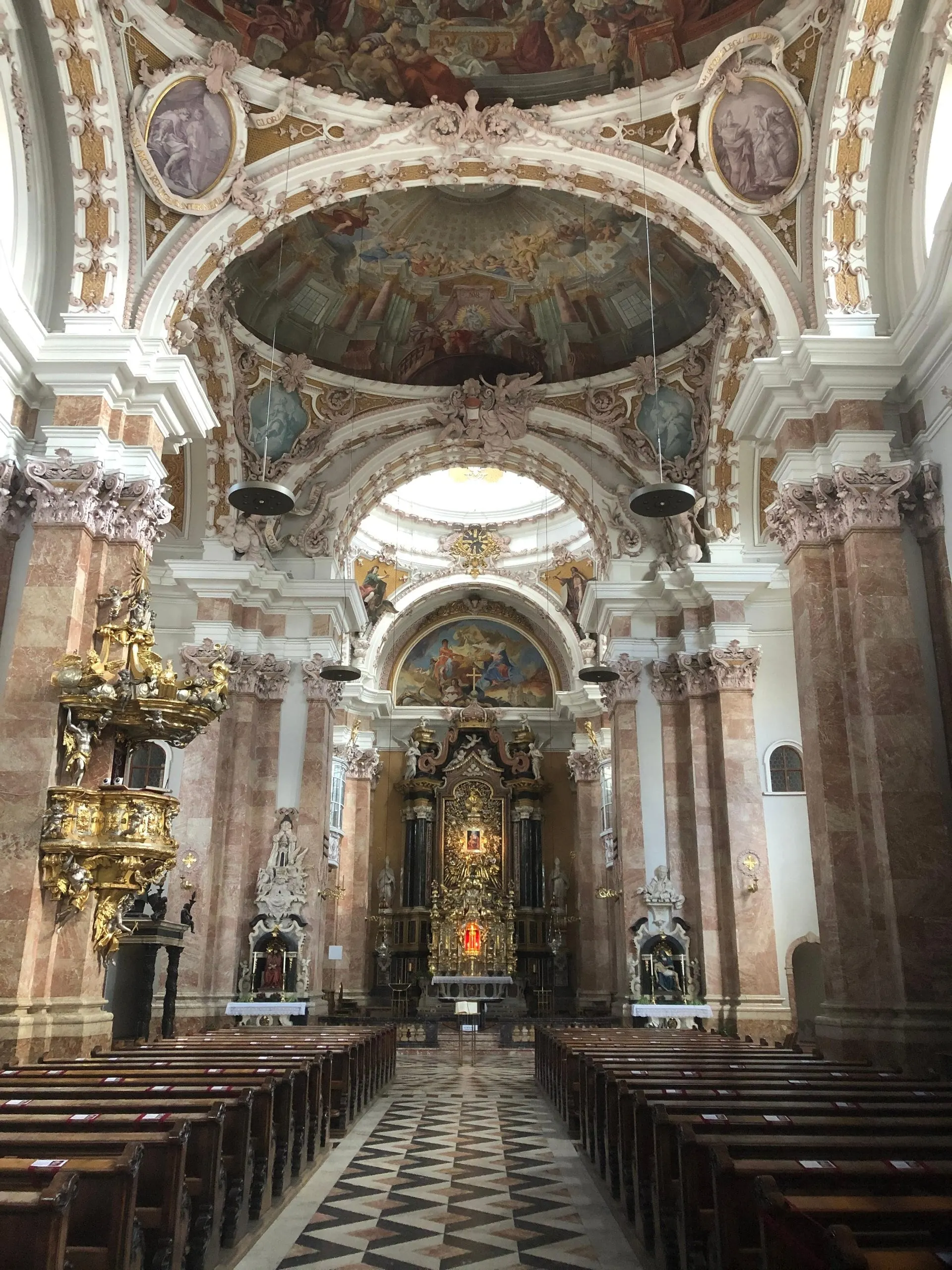 Baroque interior of Innsbruck Cathedral with gilded altar