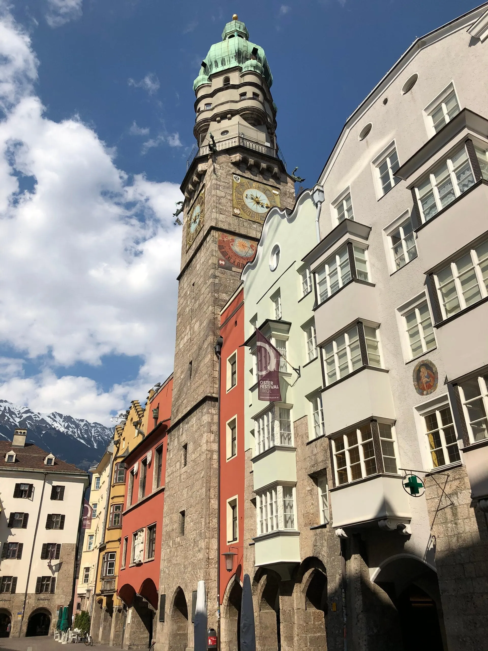 City Tower and old town façades with snowy peaks behind