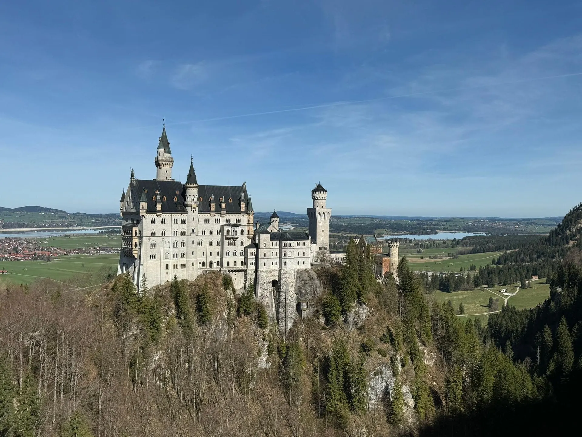 Neuschwanstein Castle on its rocky ridge above the Bavarian plain