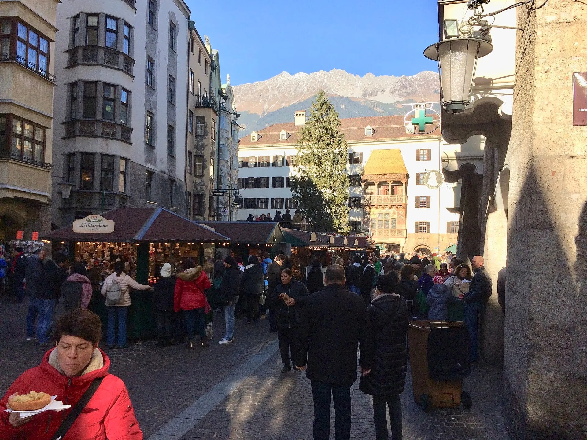 A Christmas market in Innsbruck with the snow-covered Nordkette behind